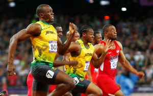Jamaica's Bolt leaps ahead to win the men's 100m final past Blake and Gay during the London 2012 Olympic Games at the Olympic stadium in London